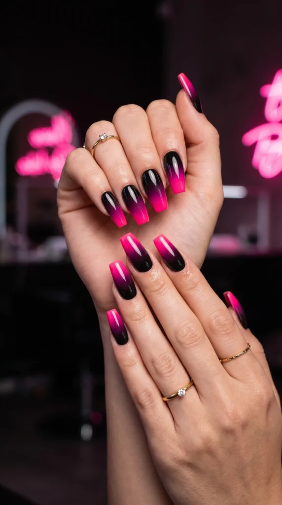 Coffin nails with bold black to hot pink ombre gradient dramatic transition glossy finish baddie iconic
