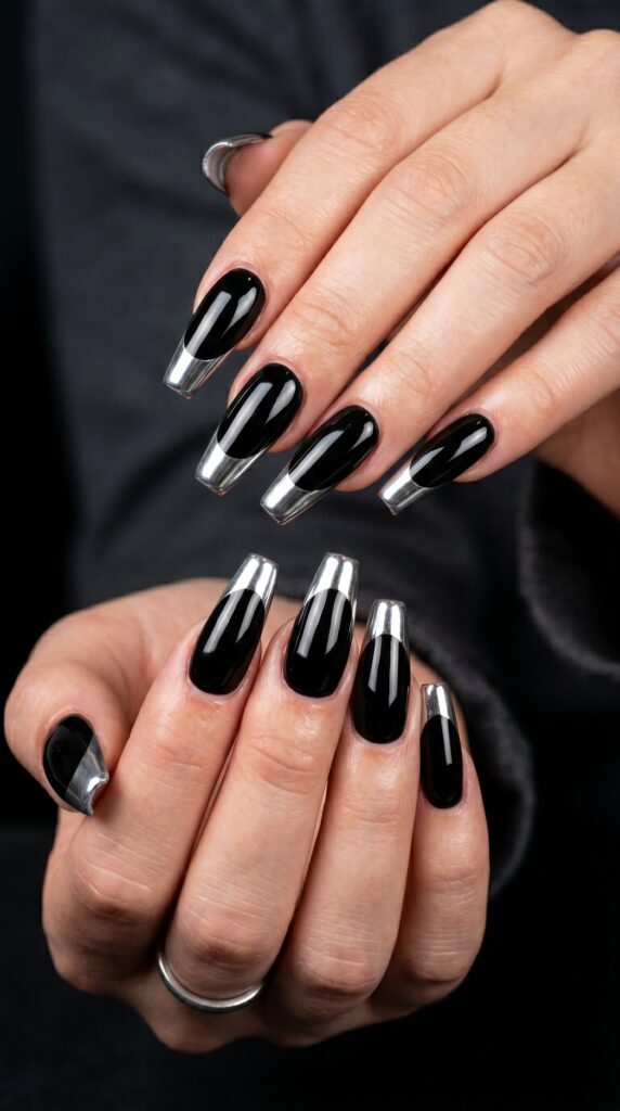 Long coffin nails in high-gloss black with silver chrome mirror tips baddie French manicure upgrade