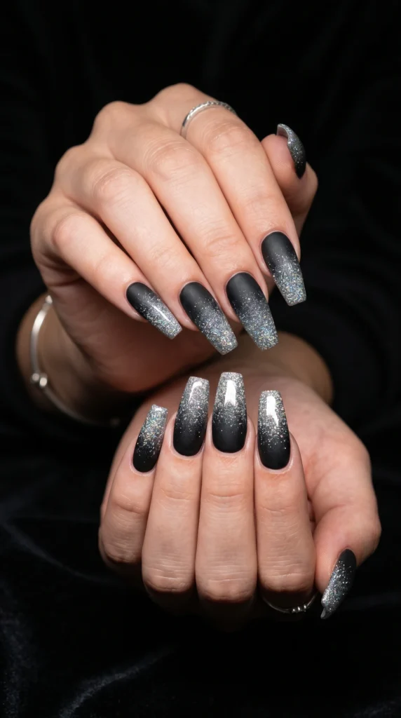 Coffin nails in matte black transitioning to dense silver holographic glitter ombre tips baddie glam