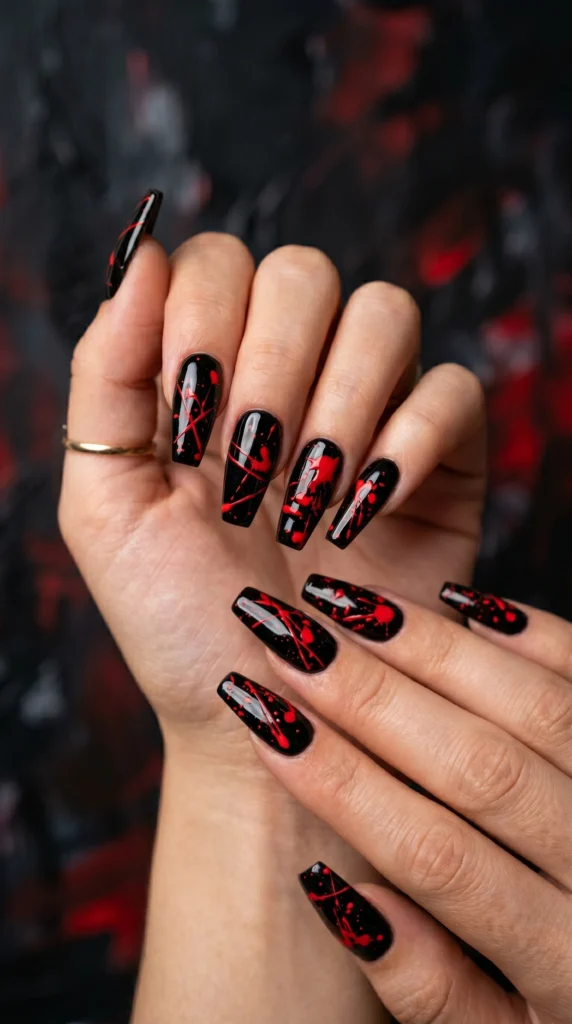 Coffin nails in glossy black with vivid red paint splatter abstract art marks random pattern baddie art