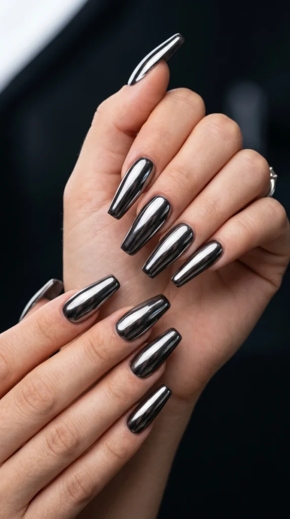 Long coffin nails in full dark gunmetal chrome mirror finish reflecting like black mirrors futuristic baddie