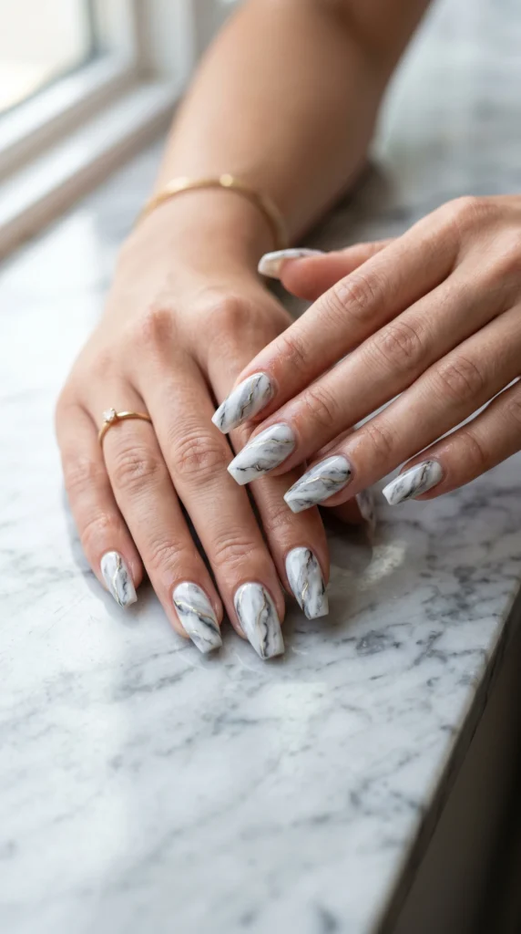 Coffin nails with grey and white marble art unique patterns charcoal veining and gold lines glossy finish