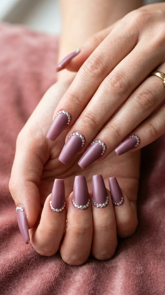 Coffin nails in dusty mauve satin with graduated rhinestone half-arch at cuticle for crown-like luxury