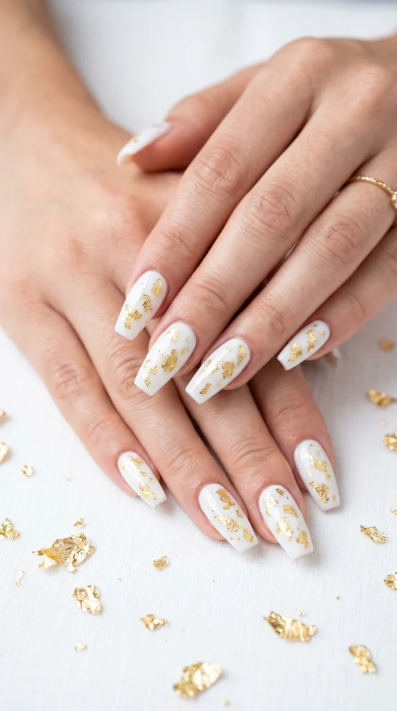 Coffin nails in snow white with real gold leaf encapsulated inside gel layer floating inclusions luxury