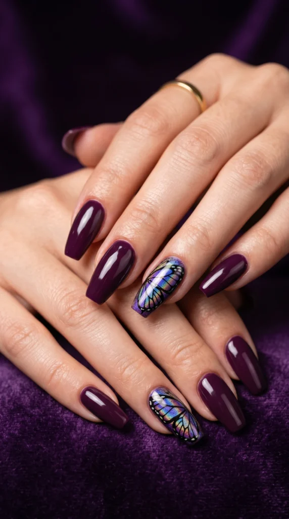 Coffin nails in deep plum with iridescent holographic butterfly art accent nails for rare luxurious look