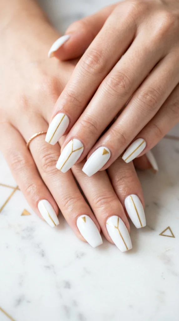 Coffin nails in porcelain white with ultra-thin hand-painted gold geometric line art for quiet luxury