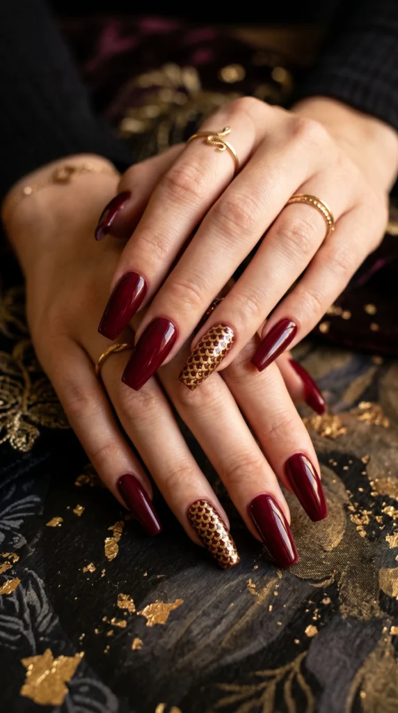 Coffin nails in deep wine red with hand-painted gold snake scale crescent art accent nails luxurious stunning