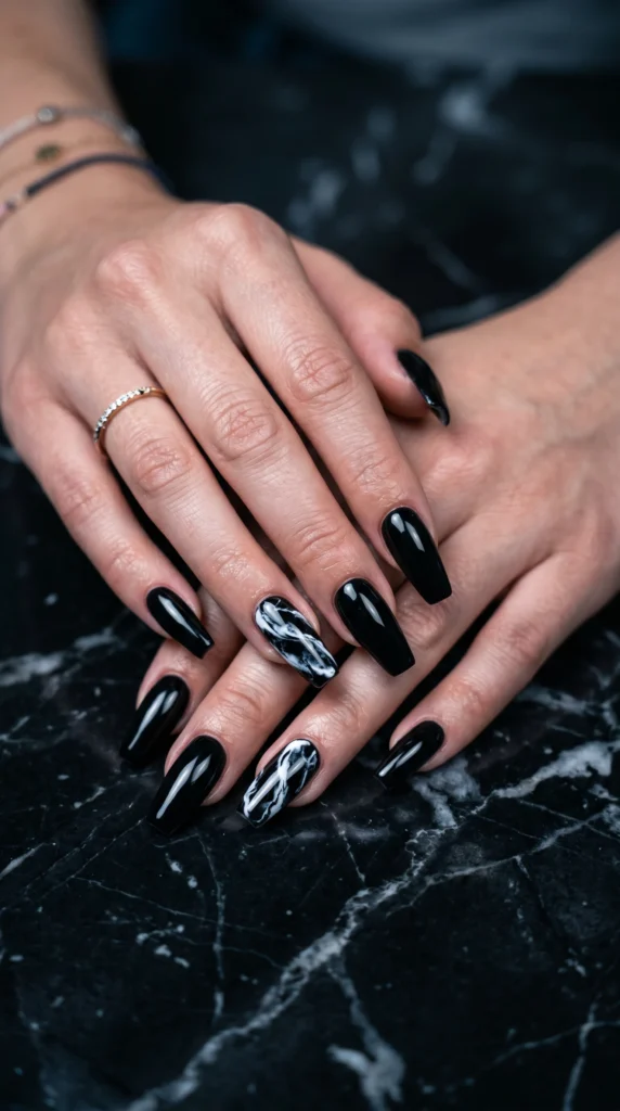 Coffin nails in jet black glossy with white marble art accent nail bold graphic stunning contrast