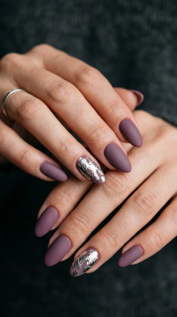 Almond nails in deep dusty mauve matte with crinkled silver foil accent nails, romantic date night style