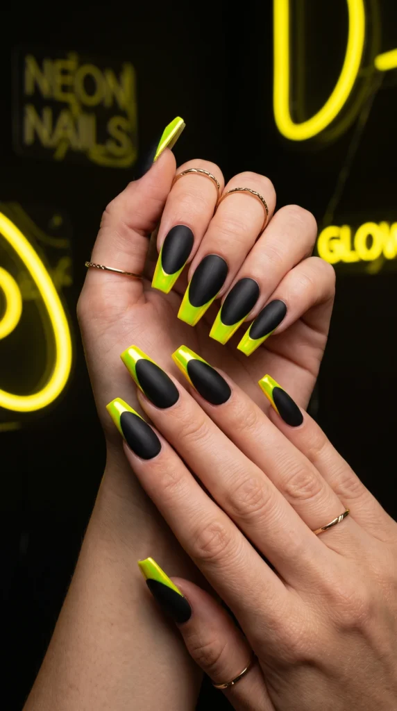 Coffin nails matte black with vivid neon yellow chrome tips sharp contrast electrifying edgy mood