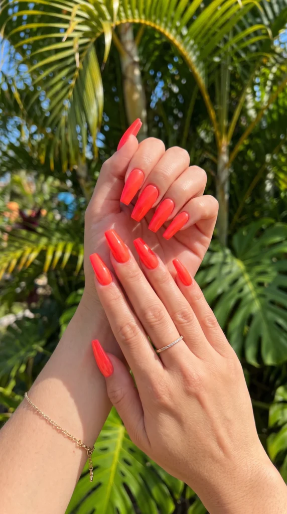 Long coffin nails in vivid neon coral glossy gel electric color summer statement no art needed