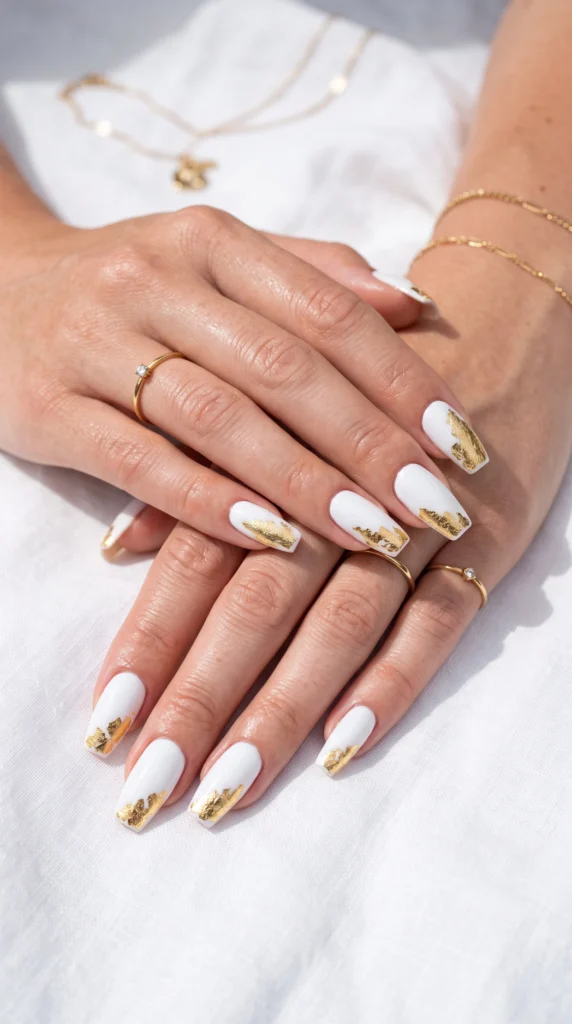 Coffin nails in bright white with organic crinkled gold foil accent patch minimal chic summer look