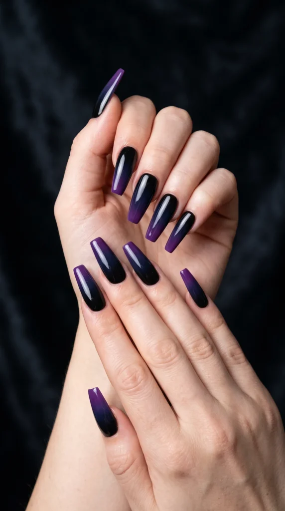 A woman with purple and black nails.