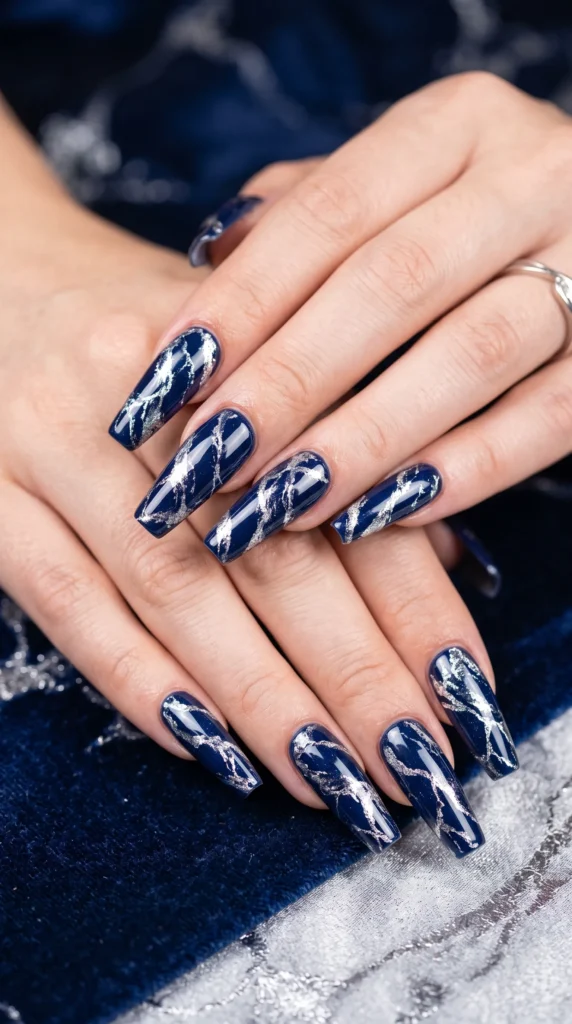 A woman with blue nail polish on her fingernails.
