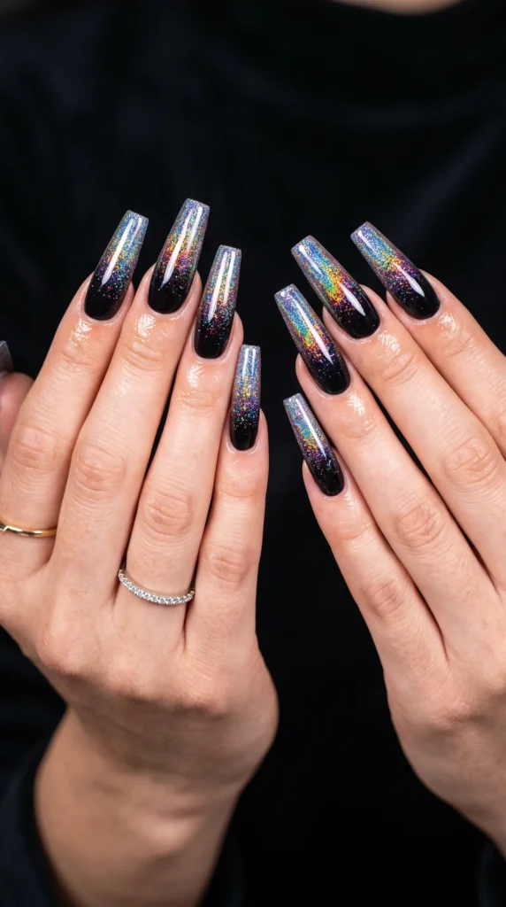 A woman with black nails and a ring on her finger.