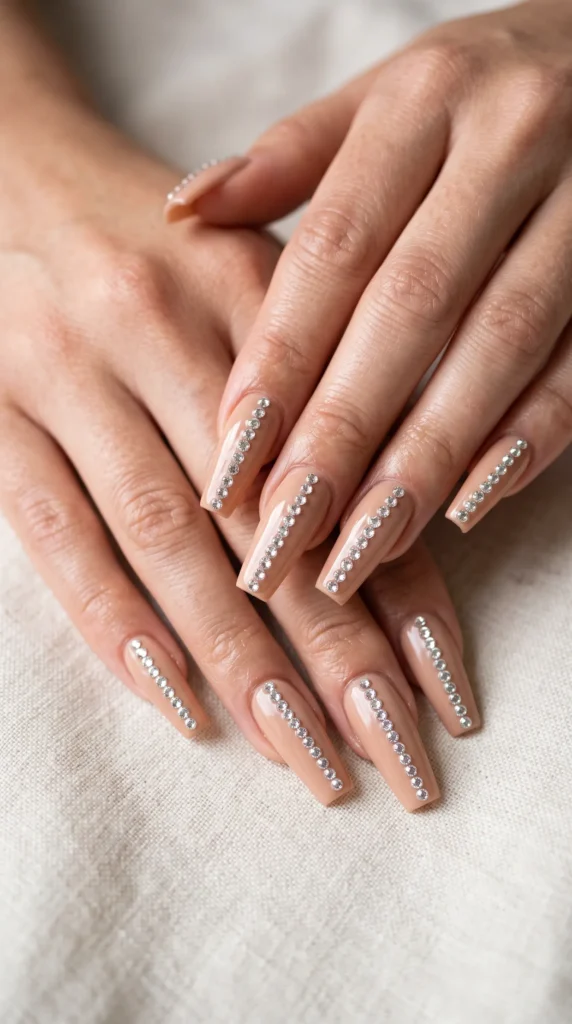 A woman's hand with a pearl nail polish.