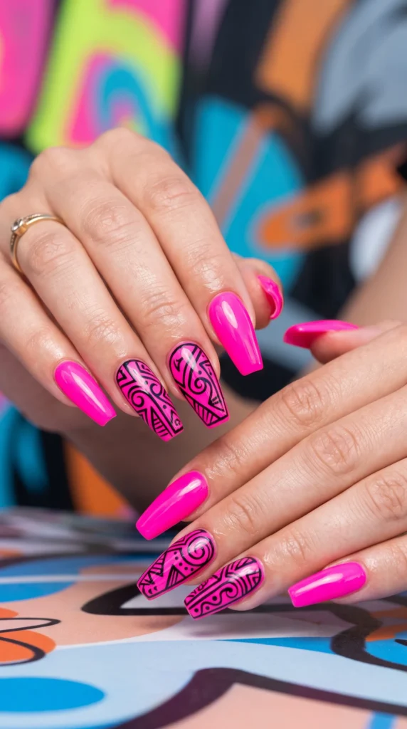 A person with pink nails and a black and white design on them.