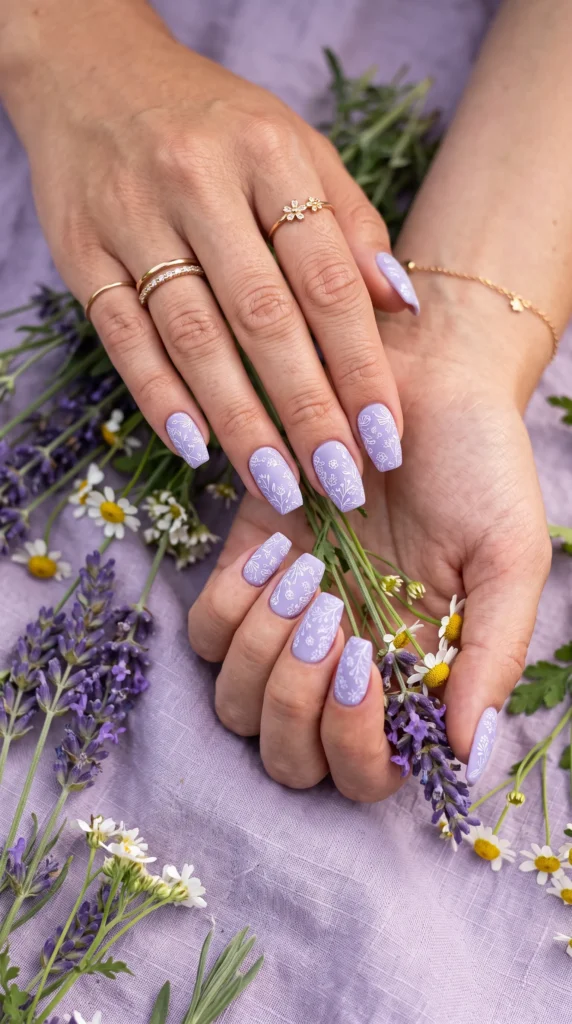 A woman with purple nail polish and a ring on her finger.