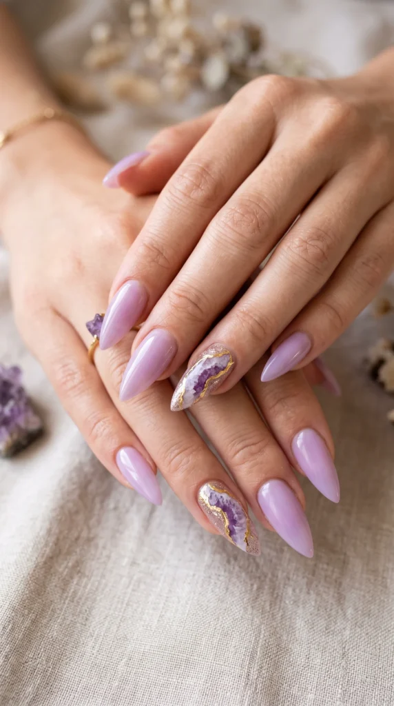 A woman with purple nails and a gold accent.