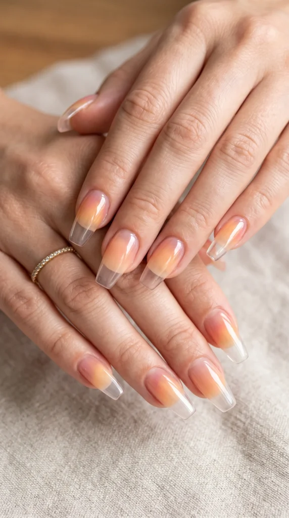 A person's hands with nail polish on their fingernails.