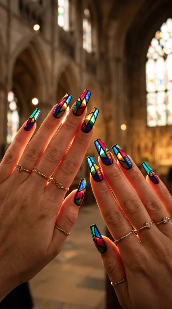 A woman with colorful nails and a ring on her finger.