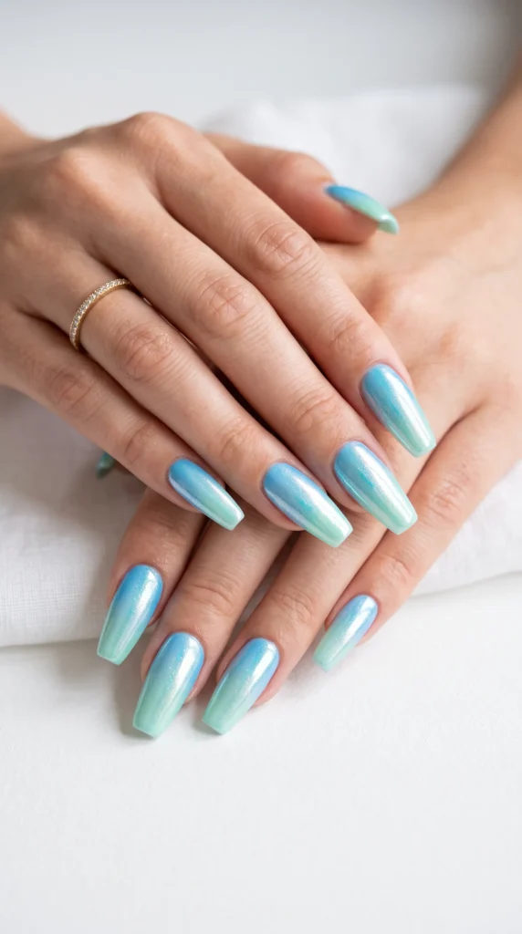 A hand with blue and white nail polish.