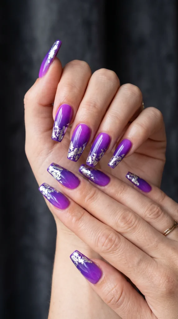 A person with purple and pink nails.