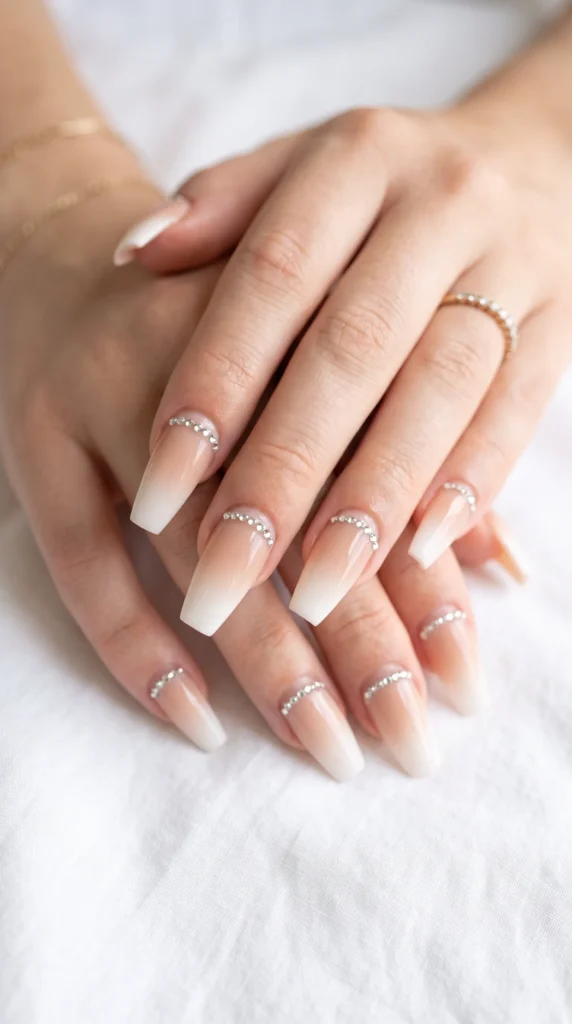 A hand with a ring on the finger and nail polish on the nails.