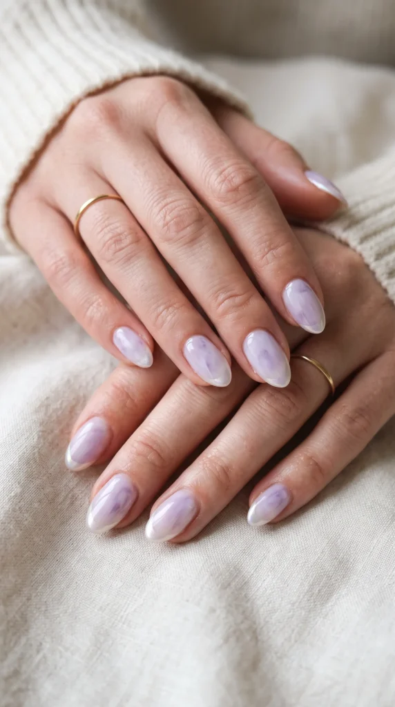 A woman with purple nail polish on her fingernails.