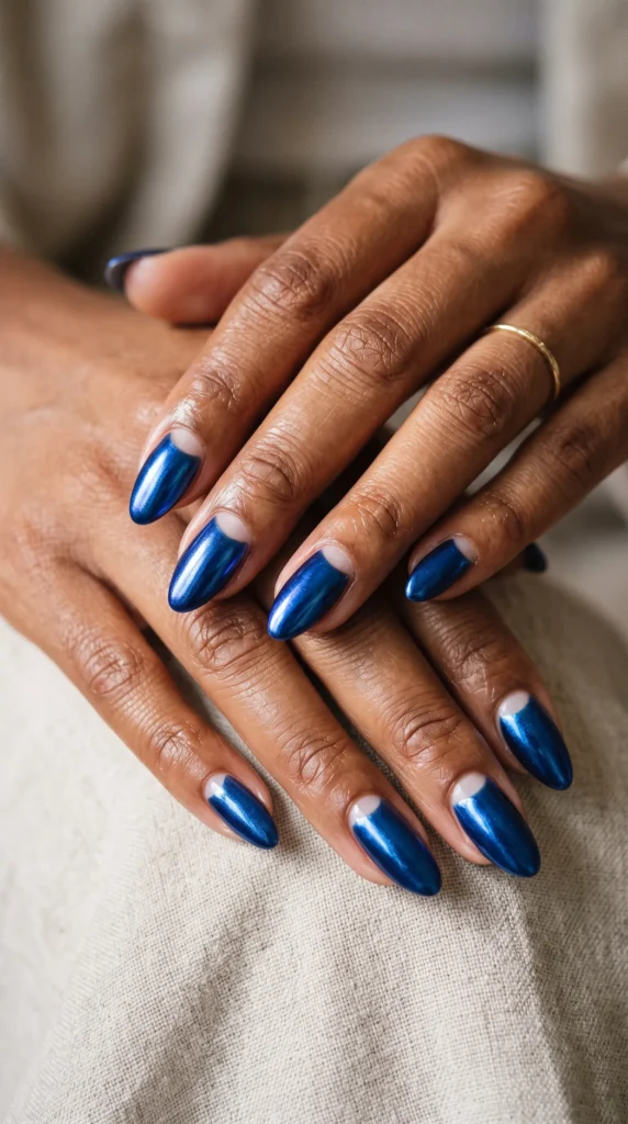 A woman with blue nail polish on her fingers.