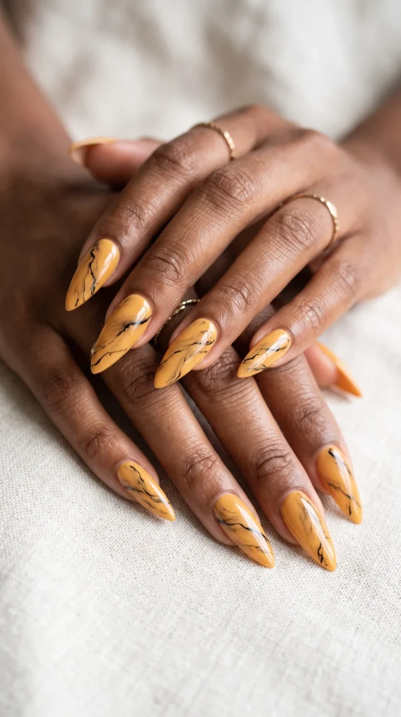 A woman with yellow nail polish and a ring on her finger.